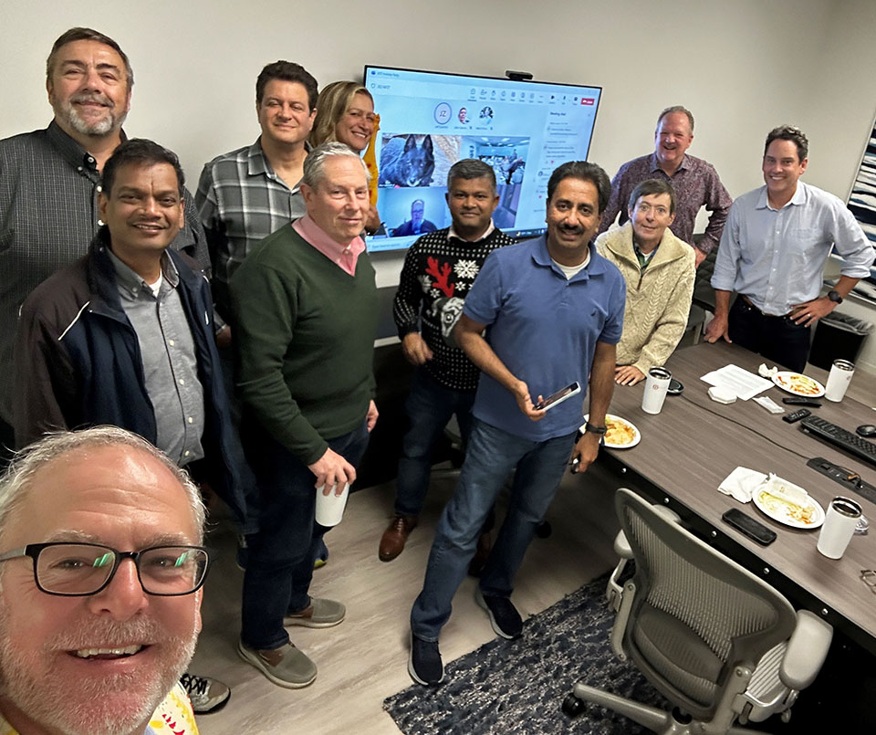 Vital Data Technology employees in a meeting.