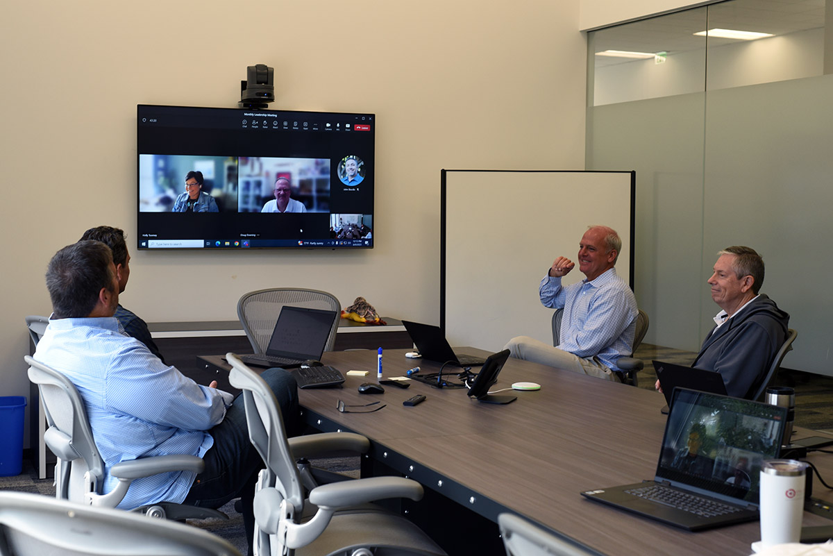 Vital Data Technology employees in a conference room.