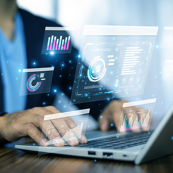 Business professional using AI tools on laptop to visualize analytics, optimize data strategy, and improve organizational efficiency in real time