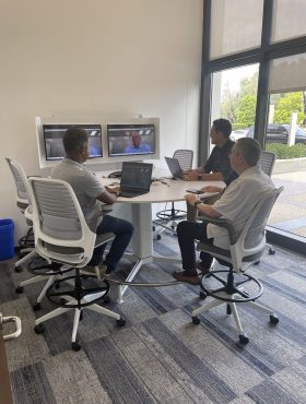 Vital Data Technology employees working in the office.